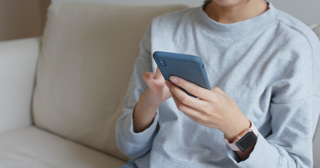 Working on cellphone at home