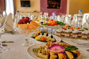 festive food on the table. A collage of different food in a restaurant. The concept of healthy eating and diet