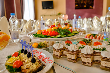 festive food on the table. A collage of different food in a restaurant. The concept of healthy eating and diet