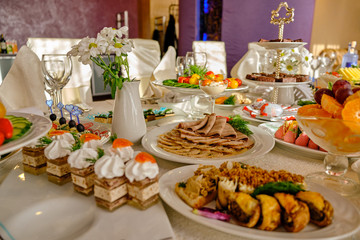 festive food on the table. A collage of different food in a restaurant. The concept of healthy eating and diet