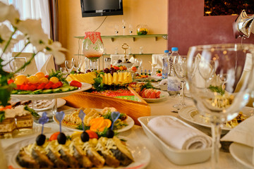 festive food on the table. A collage of different food in a restaurant. The concept of healthy eating and diet