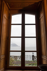 Italy, Varenna, Lake Como, a view of a large window overlooking a lake