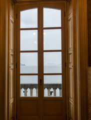 Obraz na płótnie Canvas Italy, Varenna, Lake Como, a bedroom with a large window