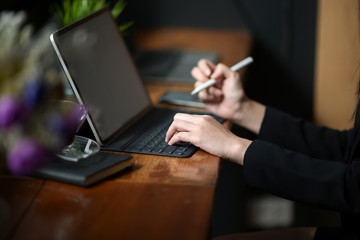 Businesswoman working on tablet computer