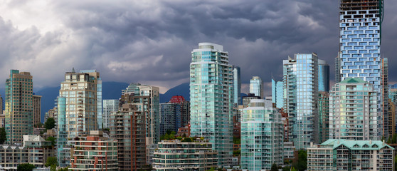 Panoramic view of Downtown City Buildings during a vibrant evening. Taken in Vancouver, British...