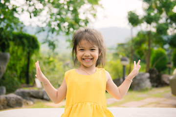 Portrait of smiling little girl in summer day.