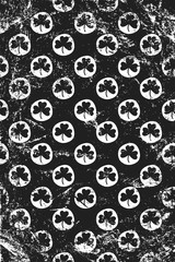 Grunge pattern with stamp signs of shamrocks. Vertical black and white backdrop.