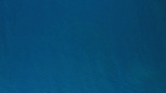 Beautiful seascape of the clear and colorful waters of the Adriatic Sea at Divna beach. Cres Island. Croatia. Aerial view. Birds eye