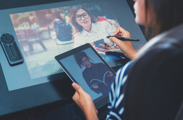 Photo of asia women are using electronic tools