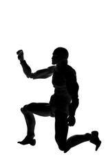 Fototapeta na wymiar Silhouette of a man in a pose on his knee on a white background