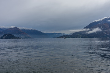 Italy, Varenna, Lake Como, a body of water with a mountain in the background