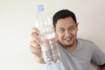 Healthy Man Drink Mineral Water in Bottle
