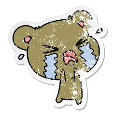 distressed sticker cartoon of a cute crying bear