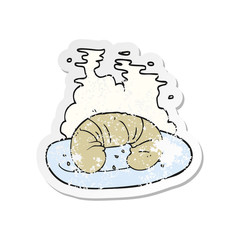 retro distressed sticker of a cartoon hot croissant