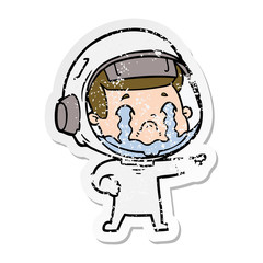 distressed sticker of a cartoon crying astronaut