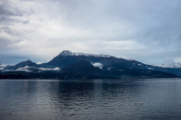 Italy, Varenna, Lake Como, a body of water with a mountain in the background