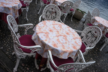 Italy, Varenna, Lake Como, a close up of a red chair