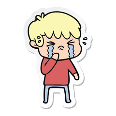 sticker of a cartoon boy crying
