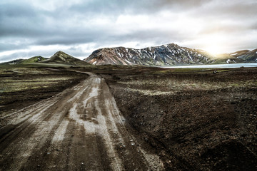 Beautiful Landmanalaugar gravel dust road way on highland of Iceland, Europe. Muddy tough terrain...