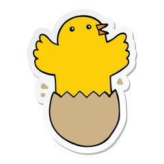 sticker of a cartoon hatching bird