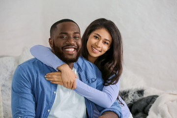 Happy African-American couple at home