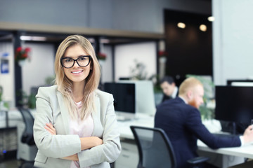 Fototapeta premium Young woman in modern office. Small business owner