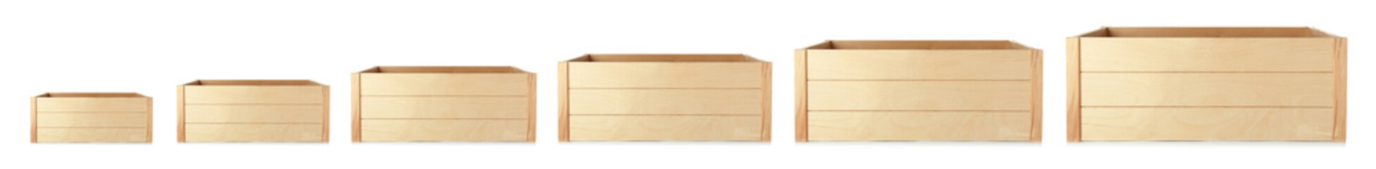 Set of empty wooden crates on white background