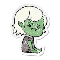 distressed sticker of a annoyed cartoon vampire girl