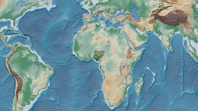 Nigeria area presented against the global physical map in the Kavrayskiy VII projection with animated oblique transformation