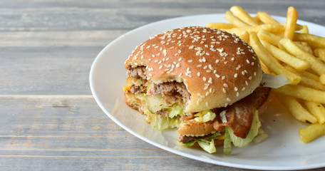 burger and  fries. take away lunch, fast food restaurant, fast food menu.pink background, selective focus and copy space. 