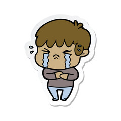 sticker of a cartoon boy crying