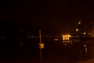Italy, Varenna, Lake Como, a view of a city at night