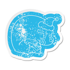 crying cartoon distressed sticker of a polar bear wearing santa hat