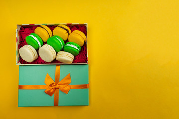 Colorful macaroons. Sweet macaroons on color background with copy space. Top view, Holiday time concept