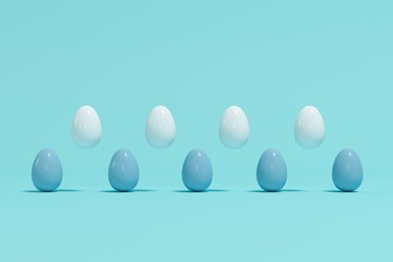 Outstanding white eggs floating in between blue eggs on light blue background. Minimal Easter idea.
