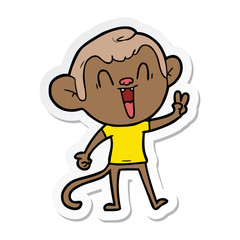 sticker of a cartoon laughing monkey