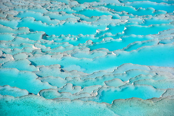 turquoise color travertine formations and thermal sources