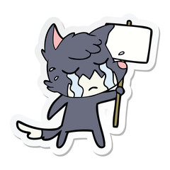 sticker of a crying fox cartoon with placard