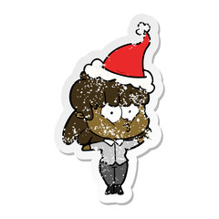 distressed sticker cartoon of a whistling girl wearing santa hat