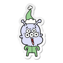 happy sticker cartoon of a alien wearing santa hat