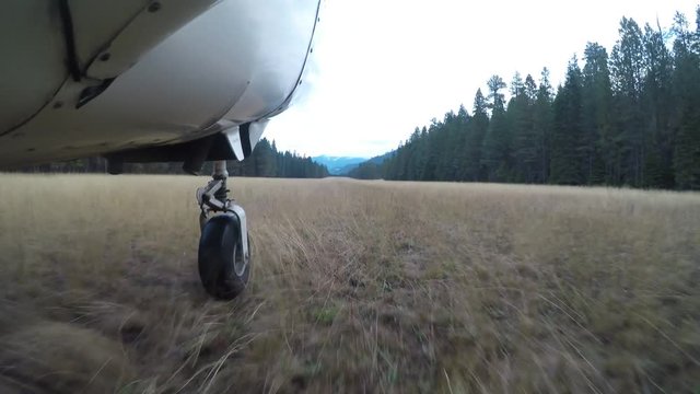 Airplane taking off on dirt runway in Idaho