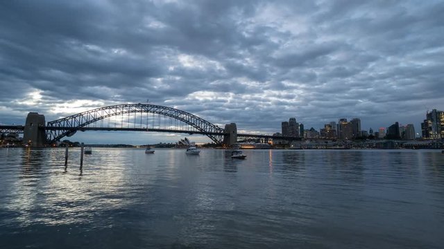 SYDNEY, AUSTRALIA - SEPTEMBER 16, 2016: 4K Cinematic Zooming In Time Lapse Footage for Sydney city skyline at sunrise, taken from Blues Point Reserve north of Sydney.
