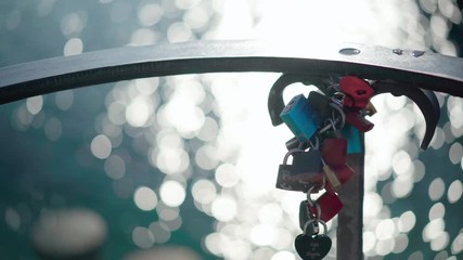 Love padlocks with ocean bokeh