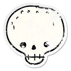 distressed sticker of a cartoon skull