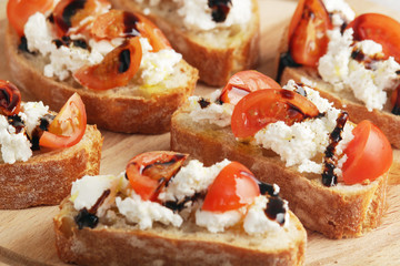 Sandwiches with tomatoes, homemade cheese, olive oil and balsamic sauce
