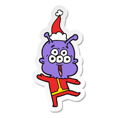 happy sticker cartoon of a alien dancing wearing santa hat