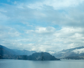 Obraz premium Italy, Varenna, Lake Como, a body of water with a mountain in the background