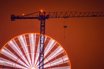 Construction site with cranes on sky background