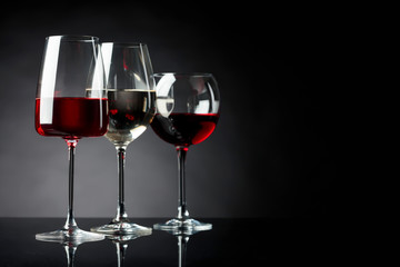 Glasses of red, pink and white wine.