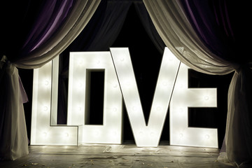 Large glowing love letters